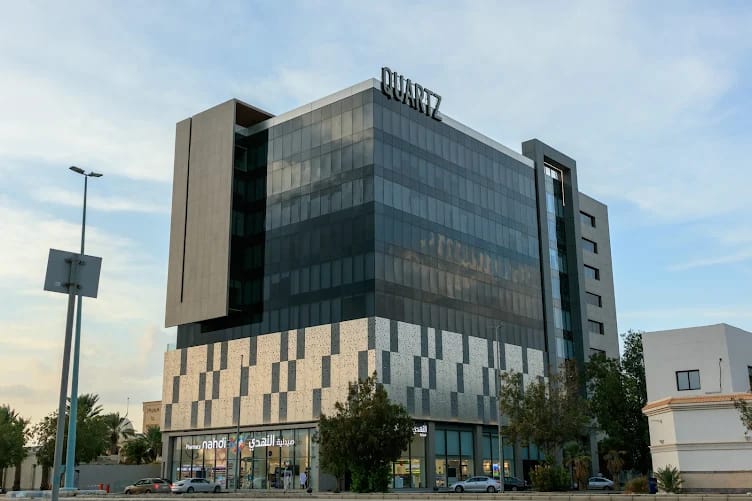 Exterior of Quartz Centre with Al Nahdi Pharmacy signage.